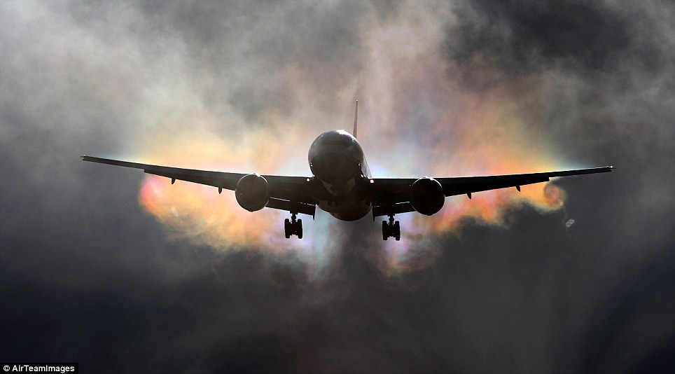 Bursting through: When a plane creates a hole in a cloud, the sunlight shining through can create some spectacular effects
