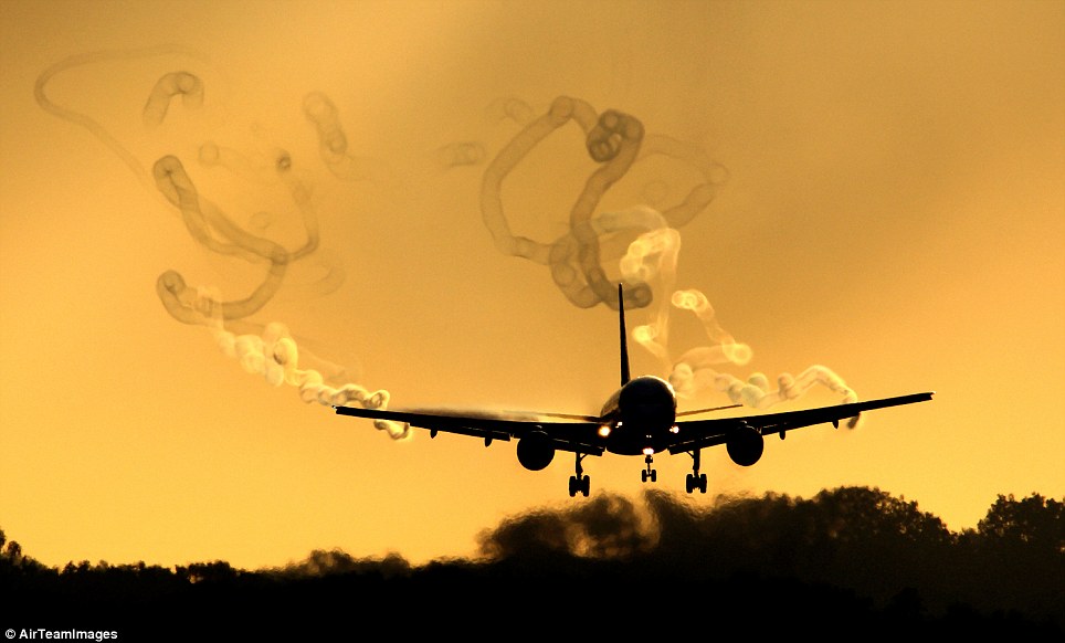 Dusk: The vortices that are formed by the aircraft can come off in erratic patterns, shown by the light hitting the trails at sunset