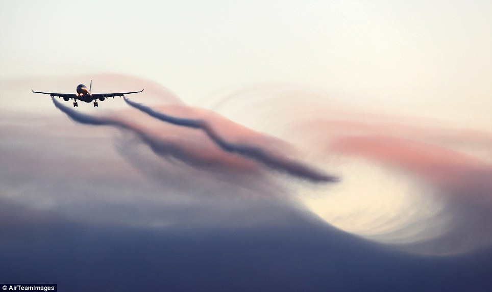 Red sky: This plane passing through the top of a cloud produces a spectacular wave effect