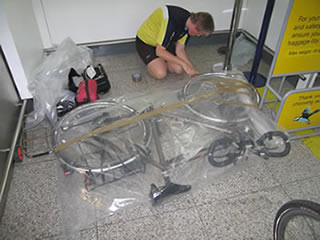 Frank adding the last bits of tape to securimagee the bike bags